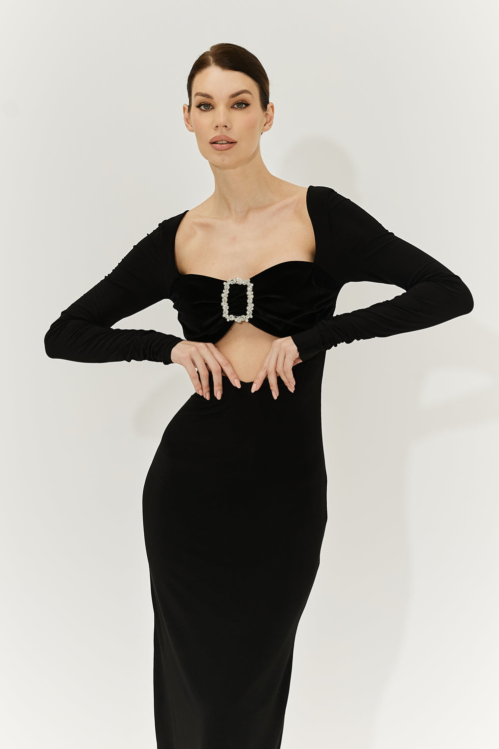 Front view of a midi-length dress with velvet bodice and crystal buckle.
