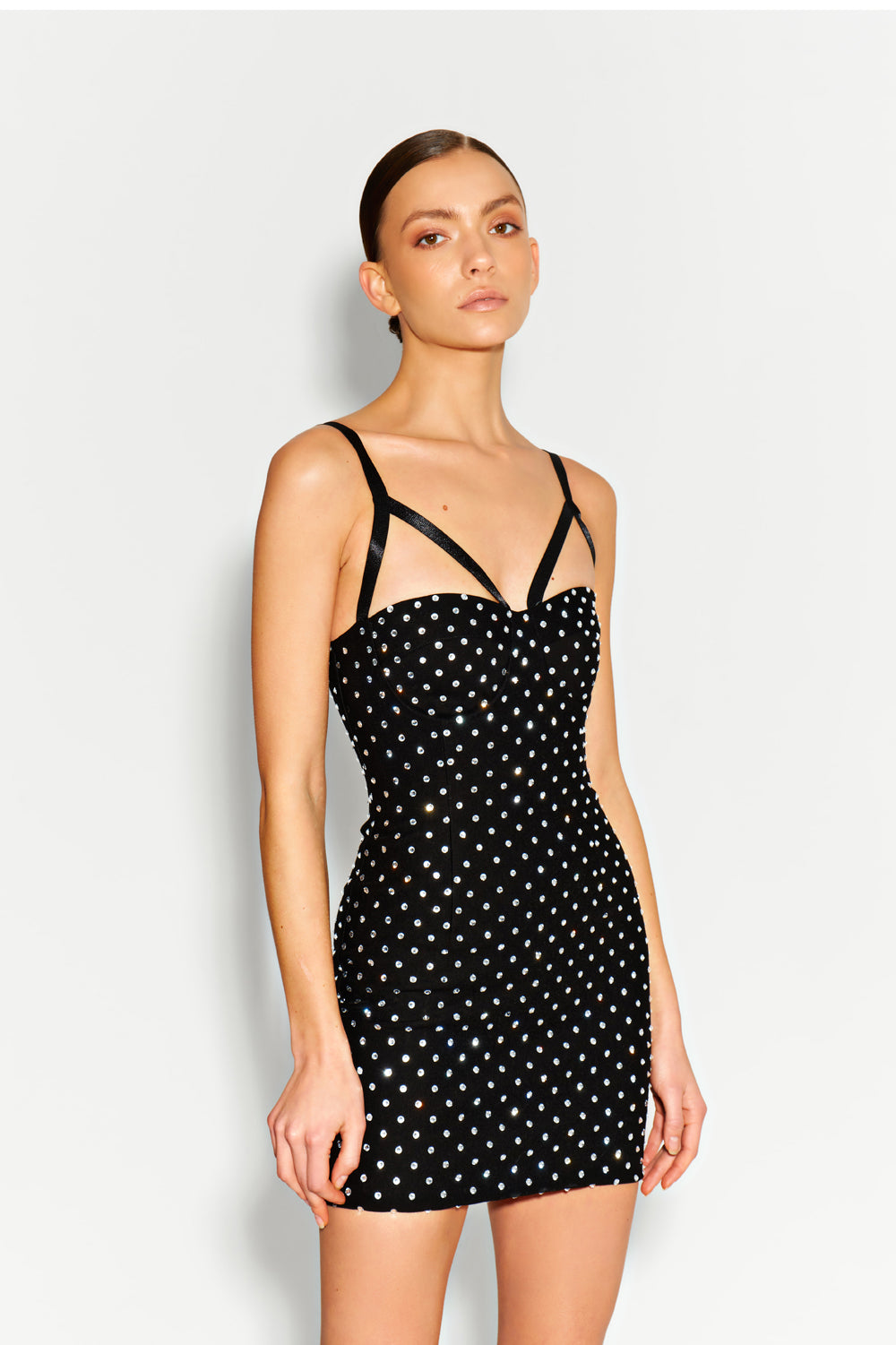 Black jersey mini dress with large crystals.