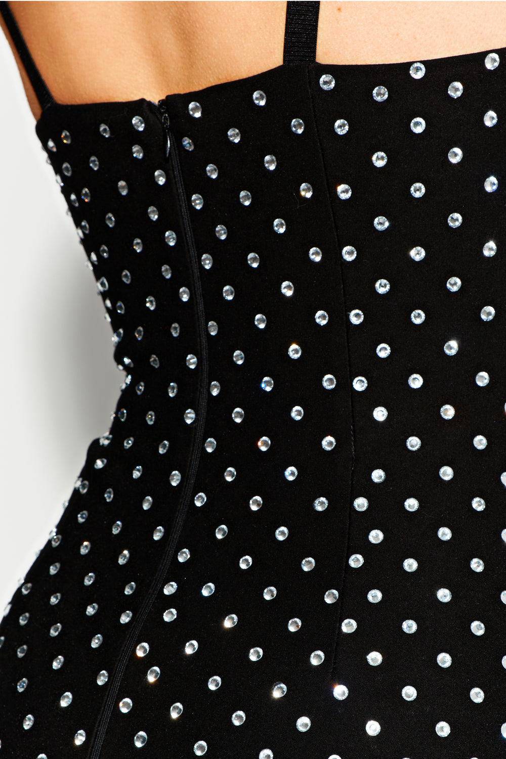 Black jersey mini dress with large crystals.