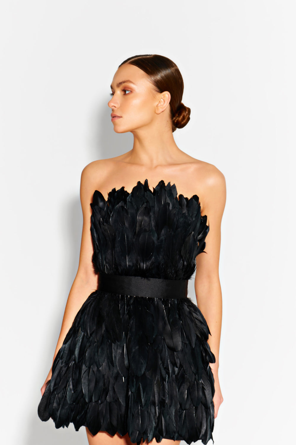 Black mini dress made of large feathers.