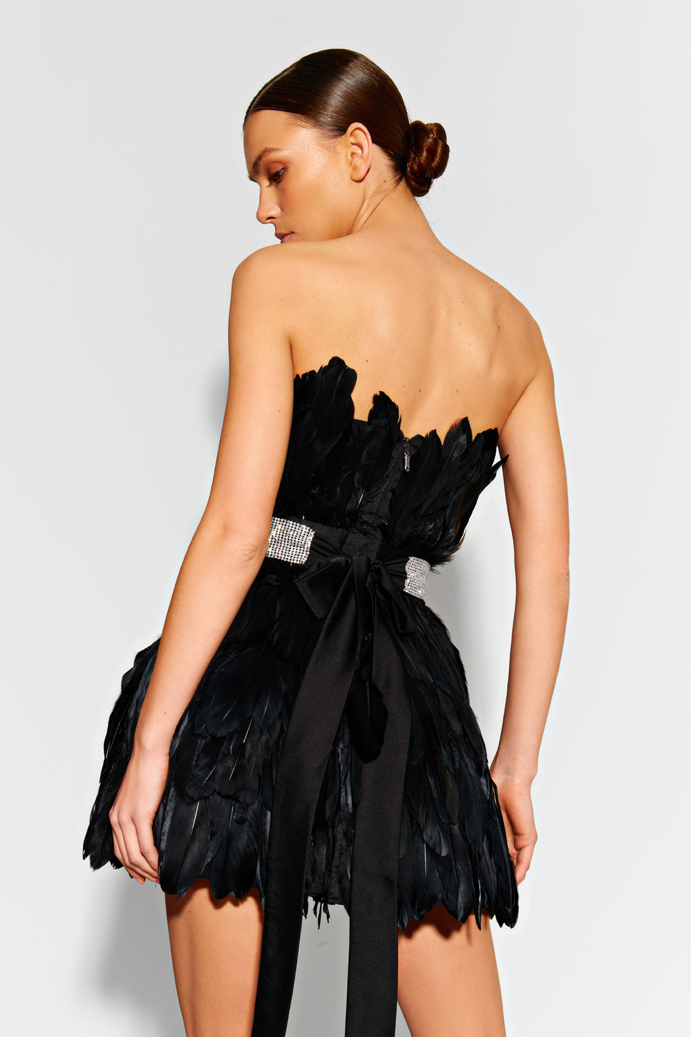 Black mini dress made of large feathers.