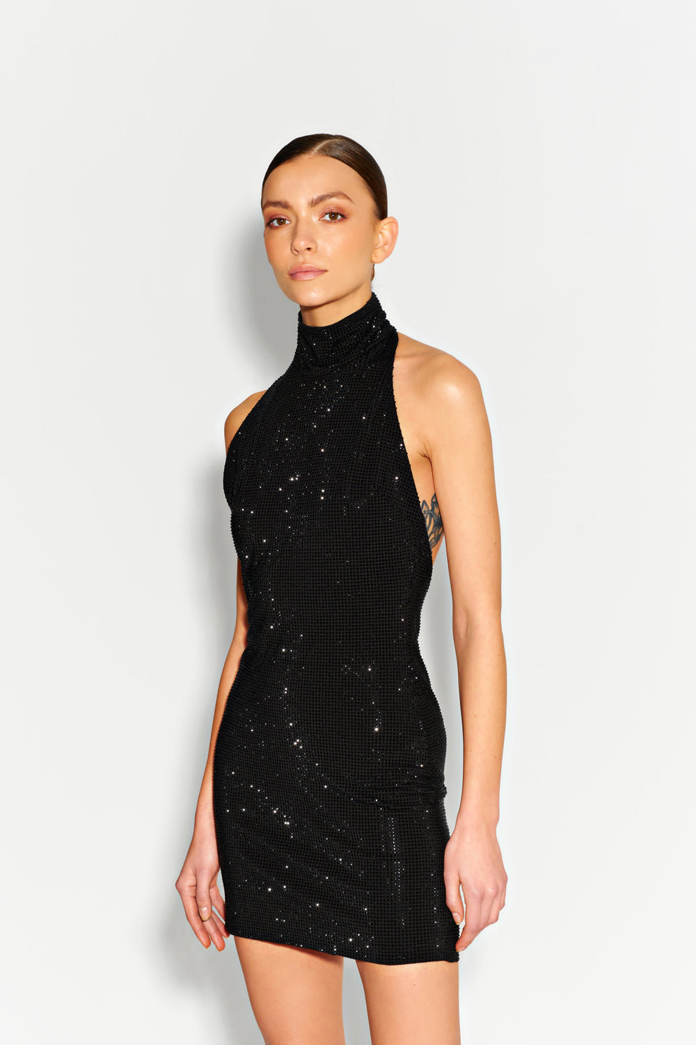 Black crystal dress with open back.