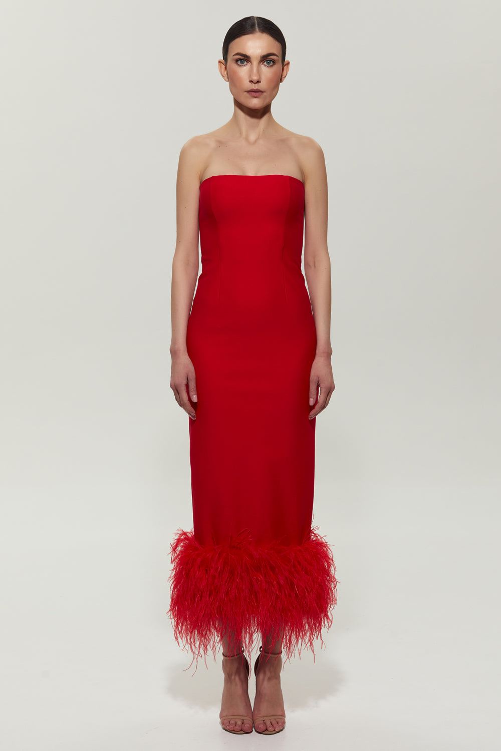 Red jersey midi dress with feathers on the bottom