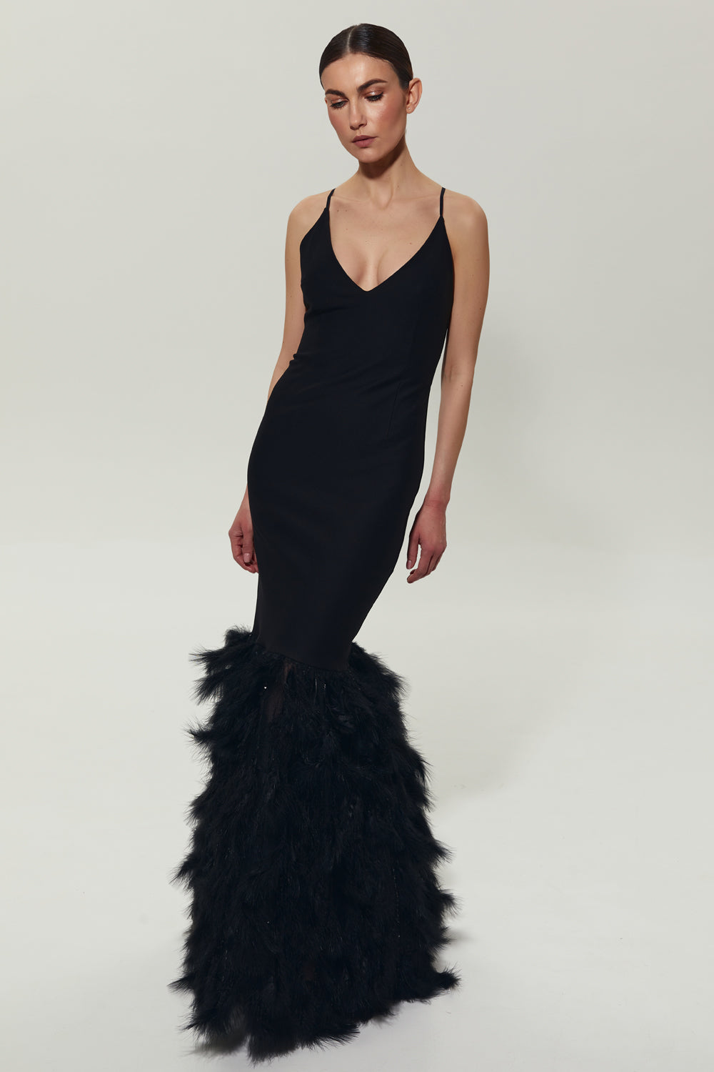 Black maxi dress with feathers on the bottom