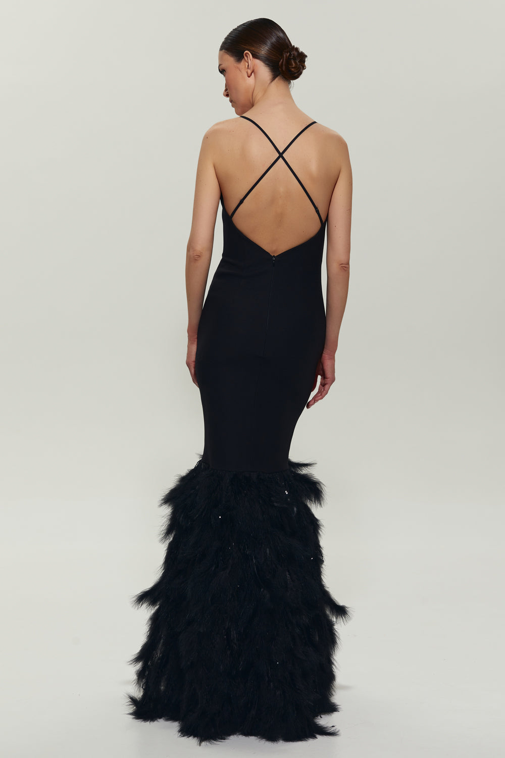 Black maxi dress with feathers on the bottom