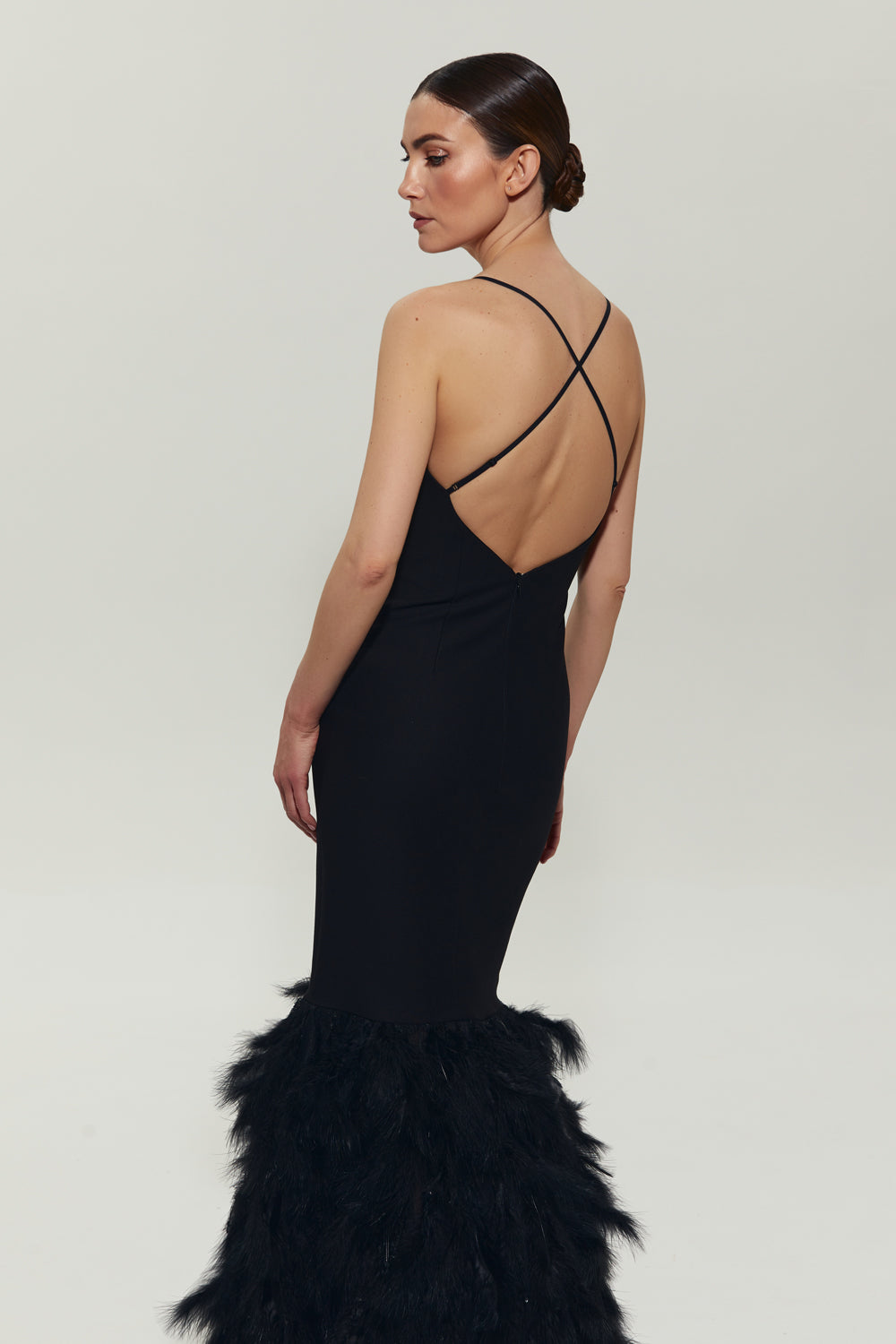 Black maxi dress with feathers on the bottom