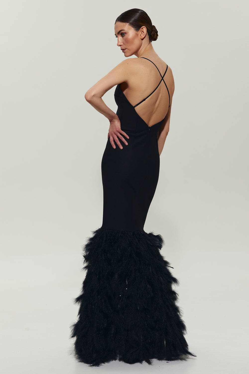 Black maxi dress with feathers on the bottom