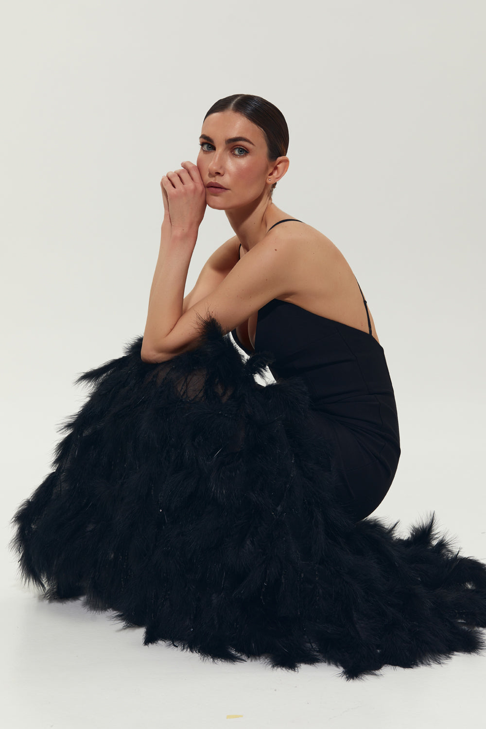 Black maxi dress with feathers on the bottom