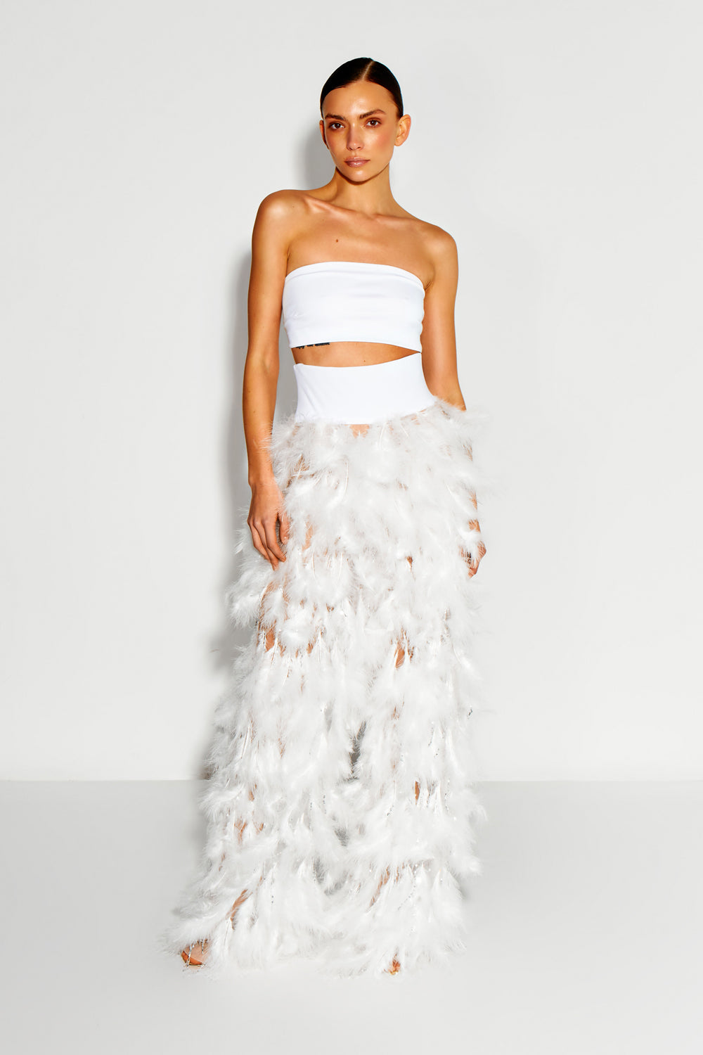 White feather-embroidered mesh pants.