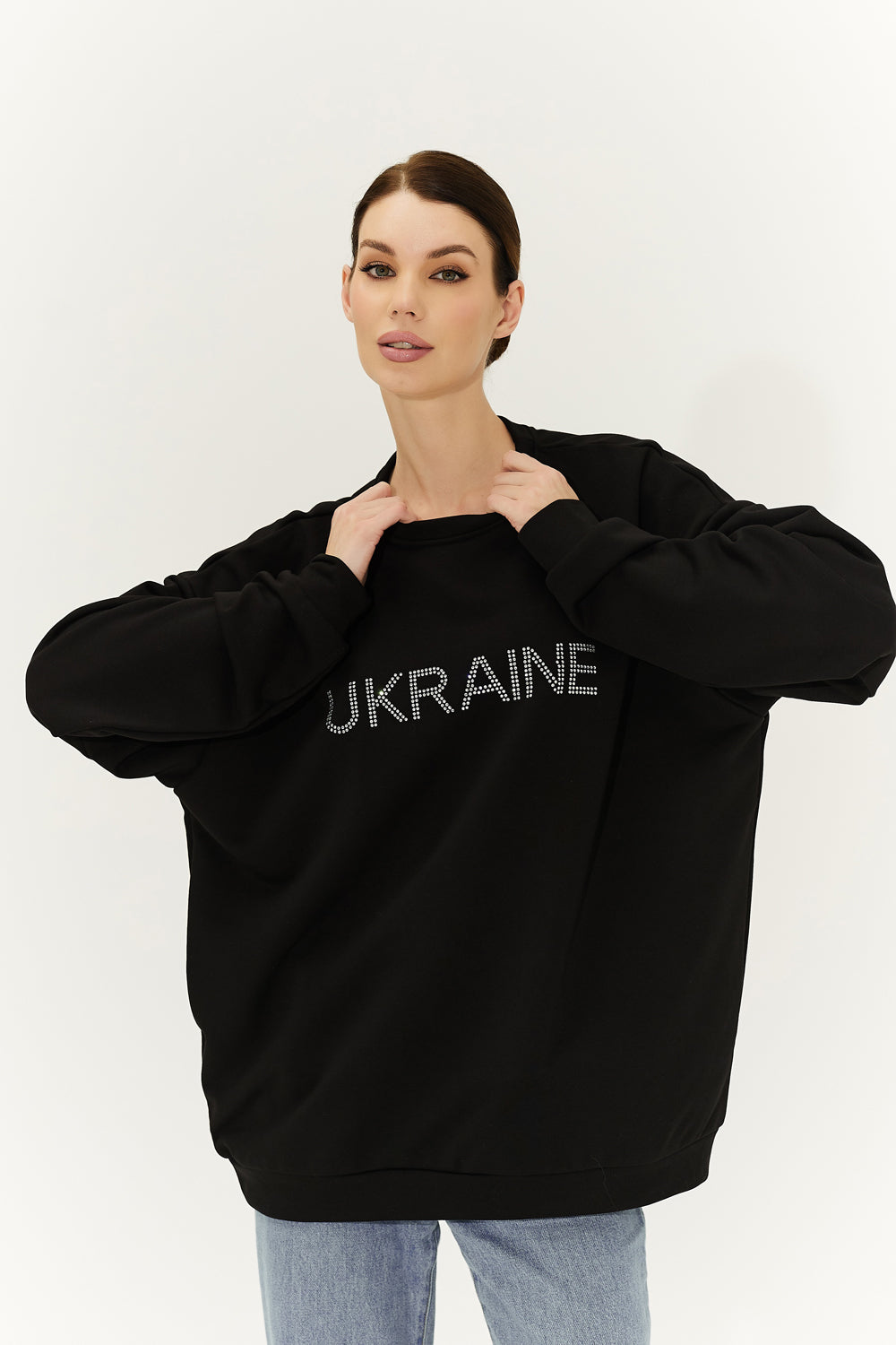 Black sweatshirt with "Ukraine" written on it.