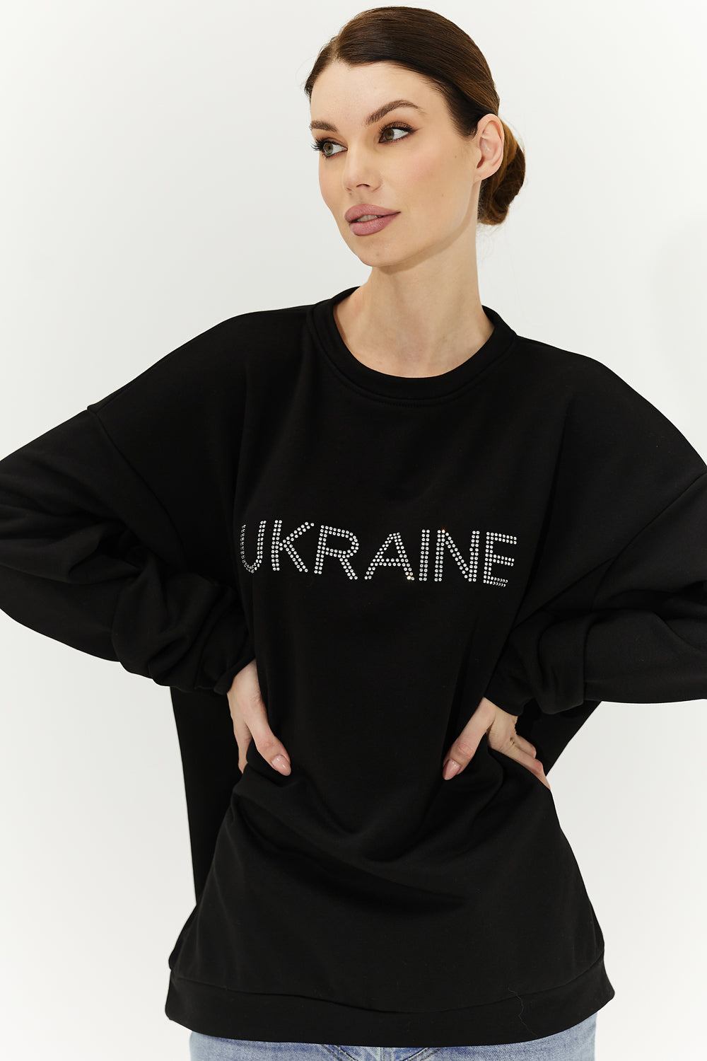 Black sweatshirt with "Ukraine" written on it.